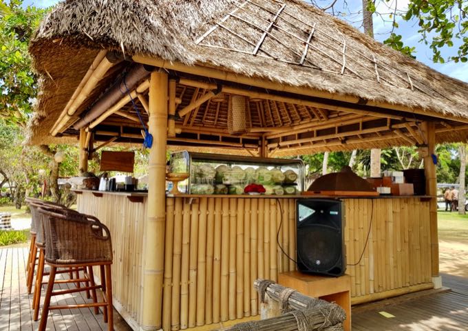 The resort has a bamboo juice bar by the beach.