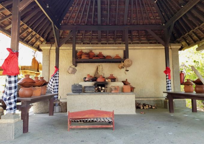 A bale Pavilion by the entrance features traditional instruments and cooking implements.