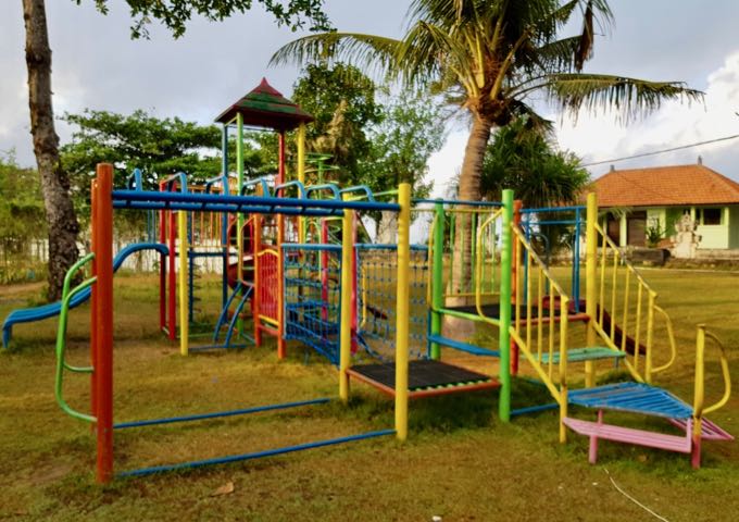 The resort features a modest playground by the sea.