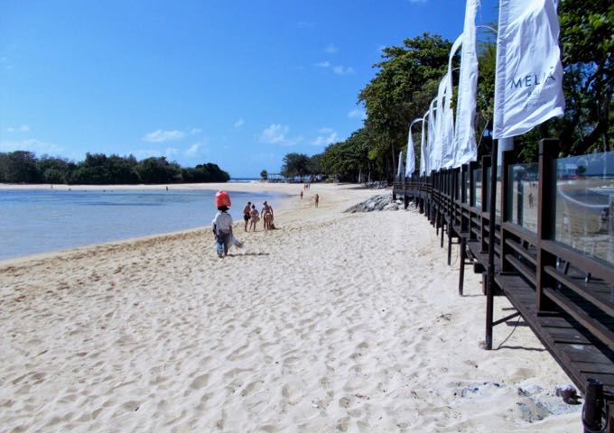 The resort beach offers white sand, calm water, and excellent views.