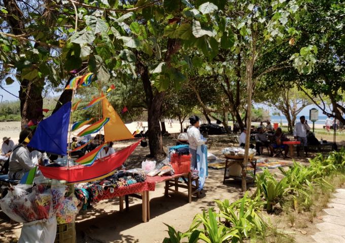 The beachside path hosts several stalls.