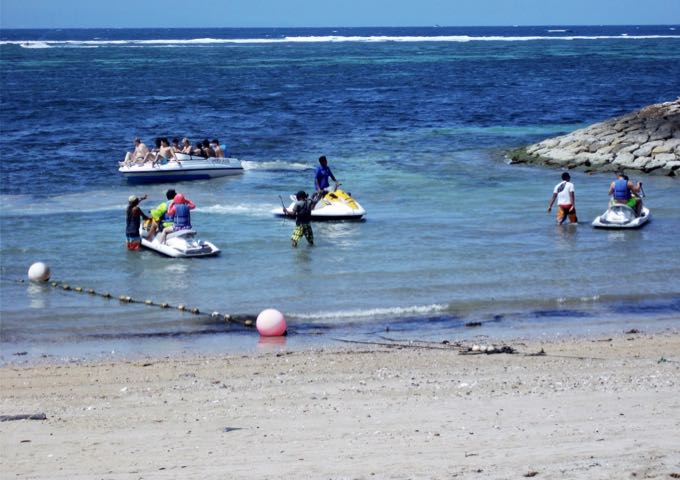 Tanjung Benoa about a km north is very popular for water sports.