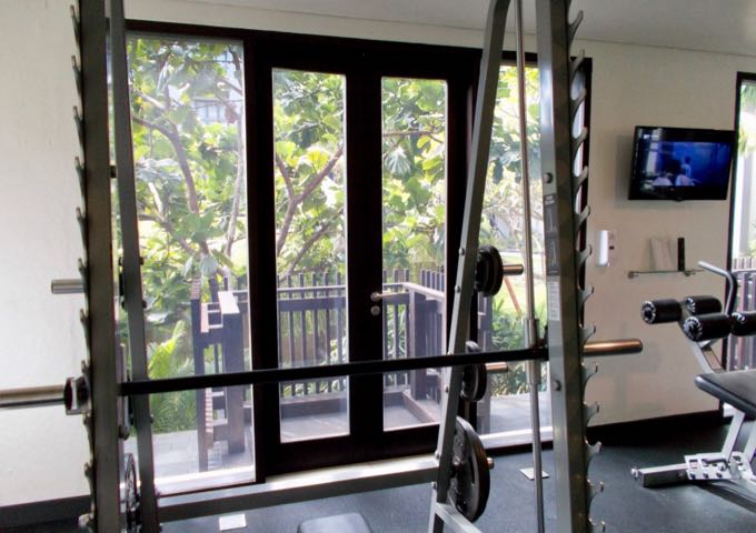 The well-equipped gym offers views of the gardens.