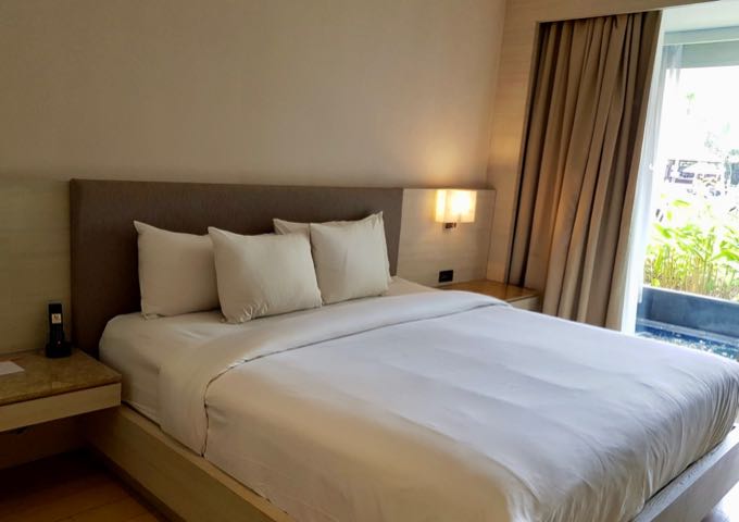 Spacious Deluxe Rooms have full-length windows.