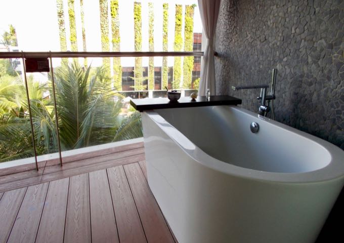 Some suites feature a bathtub on the balcony.
