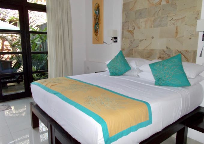 The spacious bedrooms sport a Balinese-style decor.