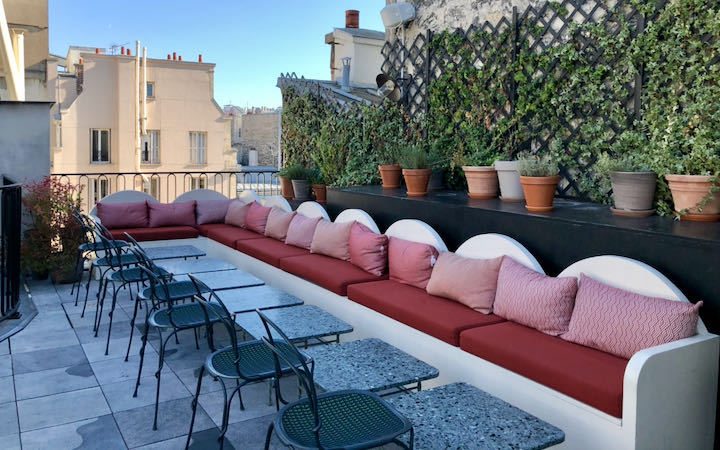 Rooftop lounge seating with plants