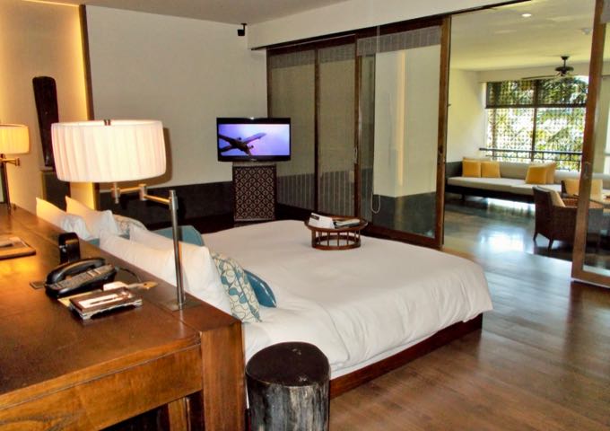 The suite bedrooms feature a mix of tropical vibe and modern conveniences.