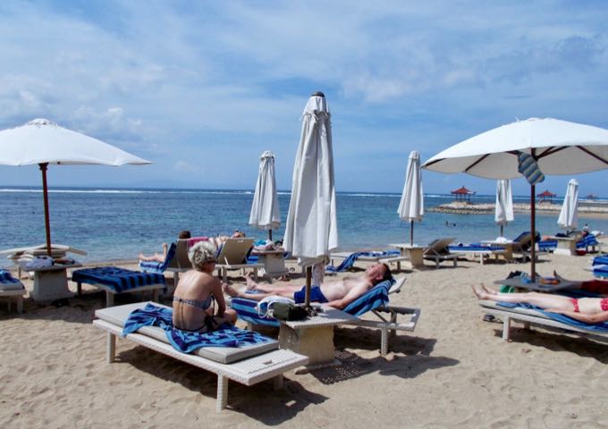 The resort beach is well-maintained by the staff.