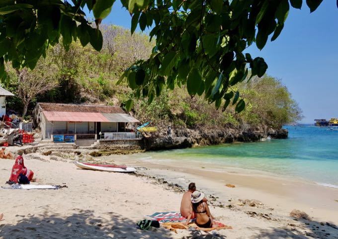 The beach has plenty of natural shade and calm water for snorkeling.