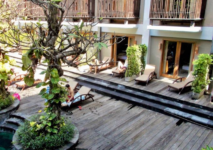 Extensive wooden decks encircle the pool.