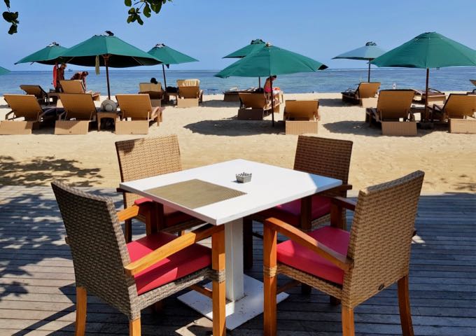 The Lado Resto offers beachside seating on a wooden deck.