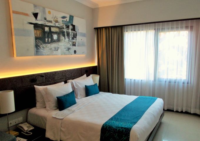 Suites feature spacious main bedrooms with modern art.