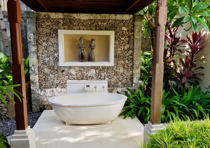 Some bungalows feature open-air bathrooms with standalone bathtubs.