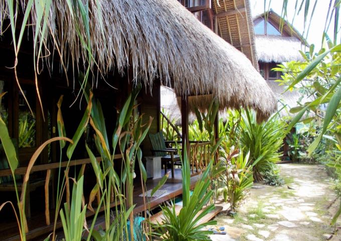 The traditionally-designed cottages have thatched roofs of alang-alang grass.