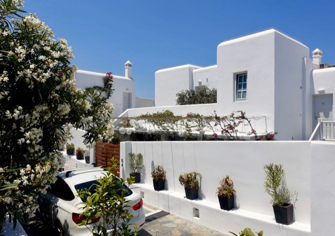 The hotel has a typical Cycladic architecture and Greek potted gardens.