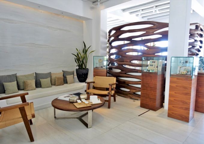 The small but sophisticated lobby has a mix of marble and wood, and a selection of jewelry from their on-site shop.