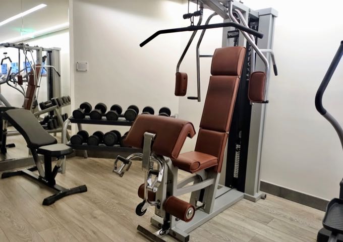 The hotel gym has cardio machines, a cable machine, and free weights.