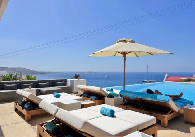 The infinity pool offers views of the Aegean Sea and Mpaos Island.