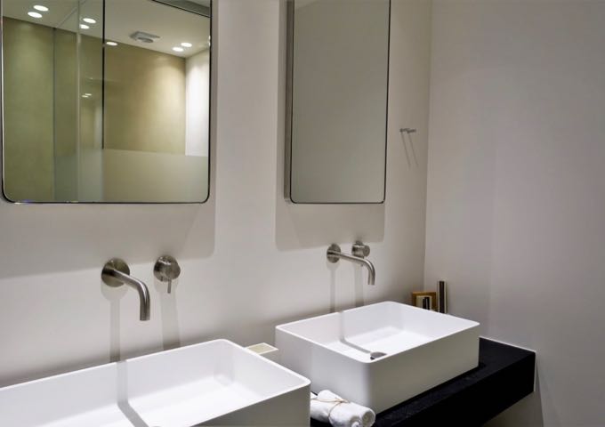 The second bedroom offers a larger ensuite bathroom with dual vanities.