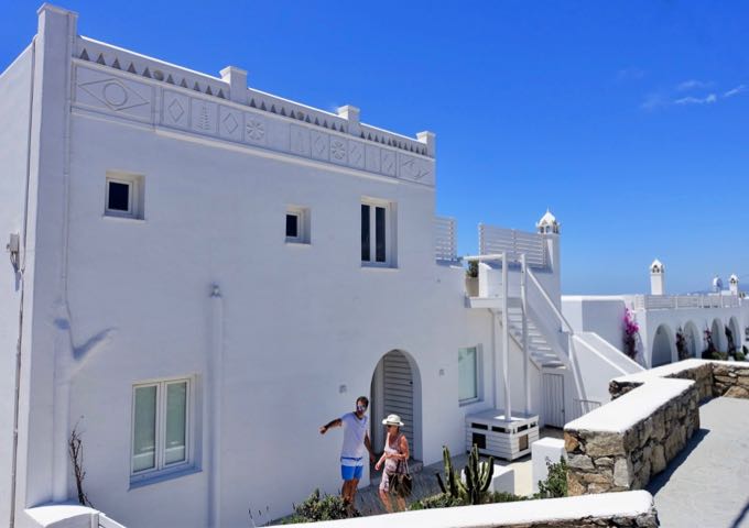 The hotel features a traditional, Cycladic architecture with Mykonian flourishes.