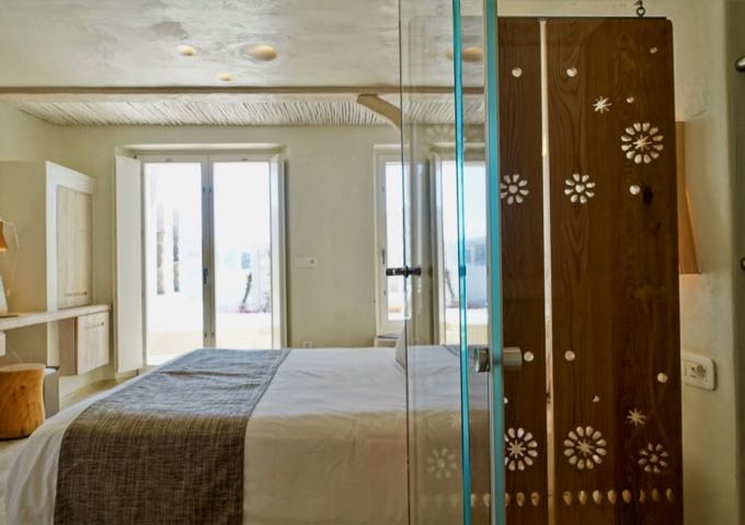 The Junior Suites have open layouts with showers visible from the main room.