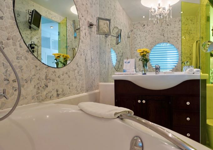 The suite's bathroom comes with a jetted tub.