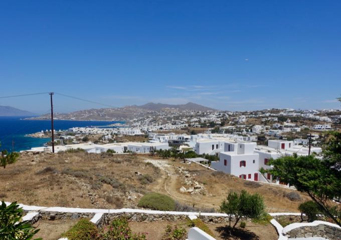 The balcony offers panoramic views of the sea and Mykonos town.