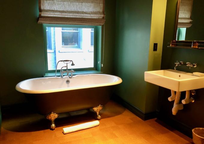 Claw-foot bathtub in the Studio King bathroom in Palihotel Seattle