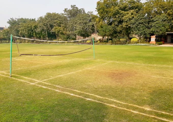 The vast lawns host a badminton court.