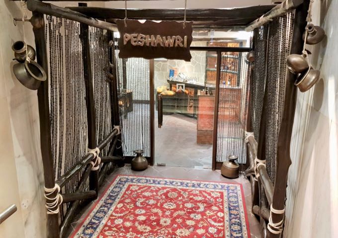 The Peshawri restaurant features a luxury desert campsite-style decor.