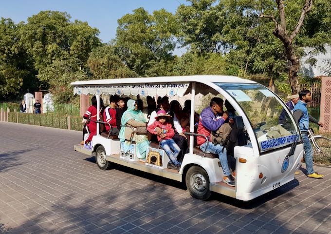 Electric shuttle buses take tourists from Shilpgram to the Taj Mahal.