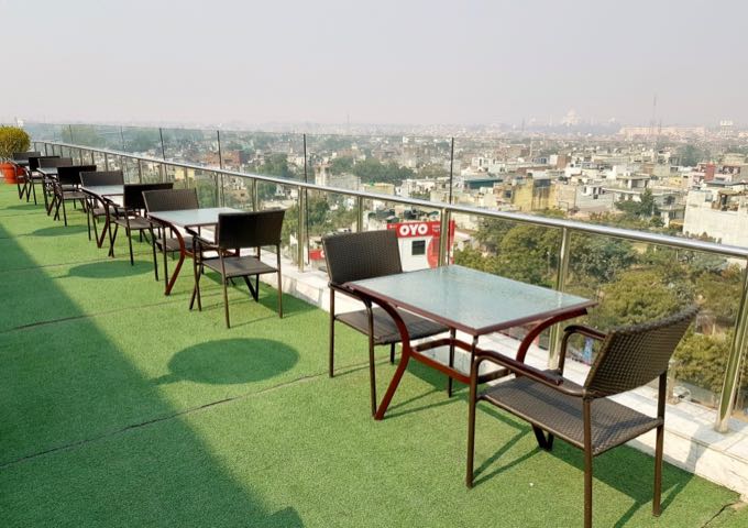 The rooftop pool-side tables offer street and Taj Mahal views.