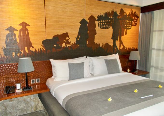 Rooms feature modern decor with Balinese themes.