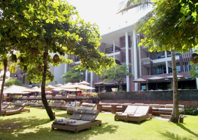 The resort's grassy lounging area is shady and private.