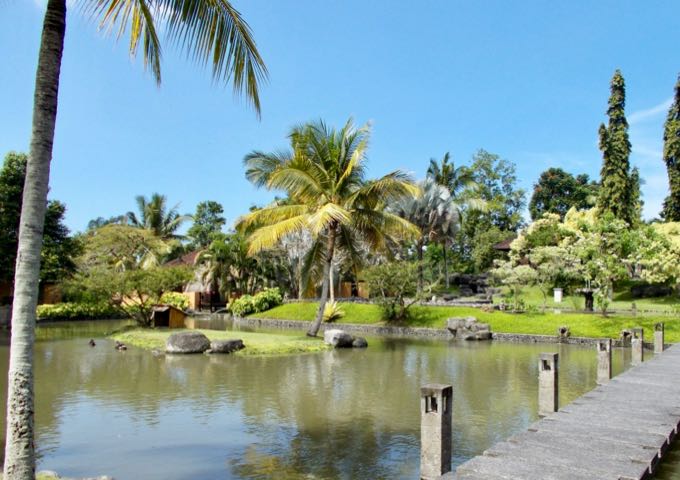 The spacious grounds feature lawns, gardens, and ponds.