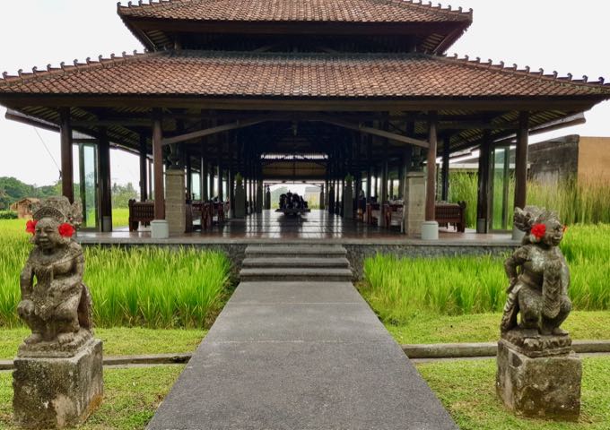 The restaurant is located among lush rice fields.