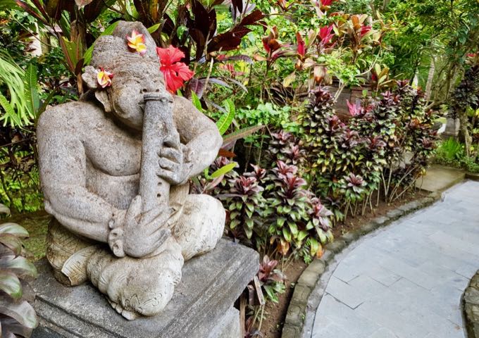The lovely gardens are adorned with traditional statues.