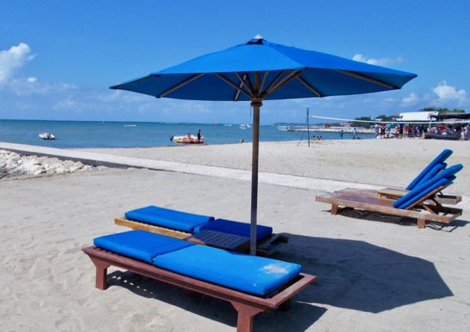 The resort offers plenty of lounge chairs and umbrellas on the beach.