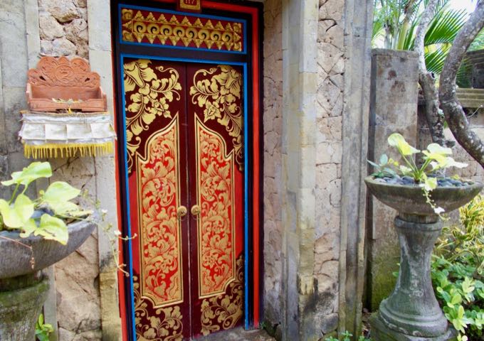 The secluded villas have ornate doors and high stone walls.