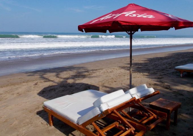 The resort offers plenty of lounge chairs on the beach for its guests.