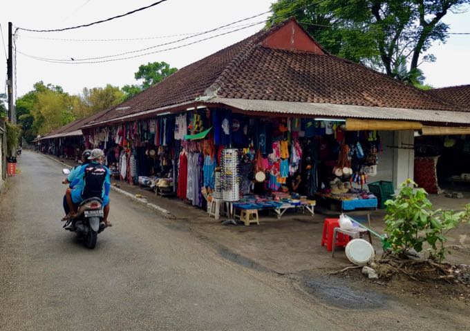A lane running toward beach from the entrance is lined with stalls.
