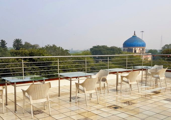 The rooftop terrace offers panoramic views of the area around Humayun's Tomb.