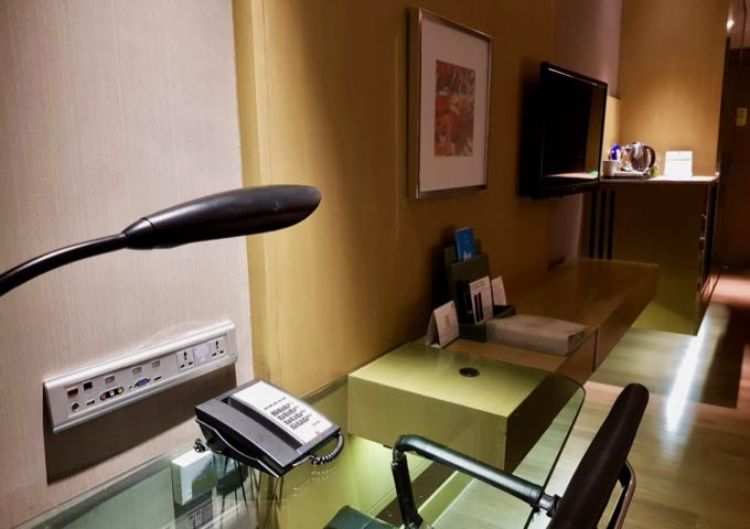 The subtly decorated rooms have modern amenities.