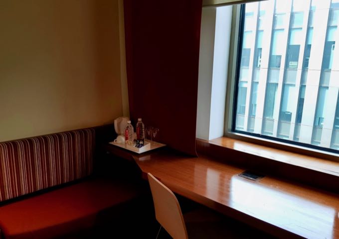 Rooms feature sofas and desks by the windows.