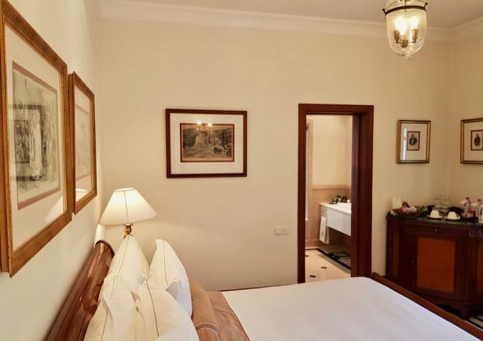 Rooms feature colonial era prints and decor.
