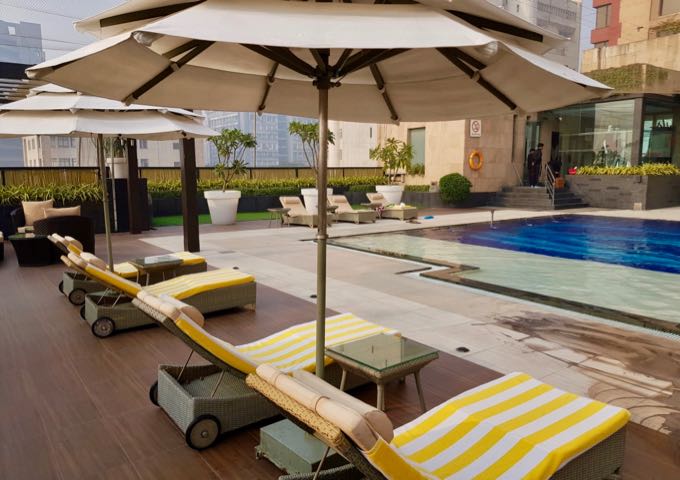 The pool deck features several lounge chairs.