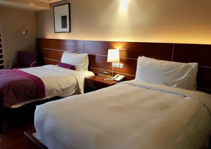 The spacious rooms are colorful and come with full-length windows.