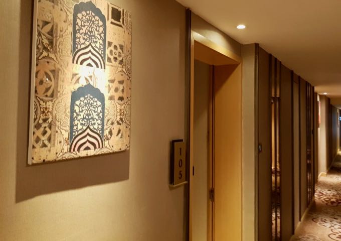 The hotel features beautiful Indian art on the corridor walls.