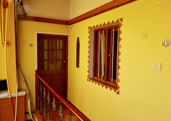 Some rooms feature wooden shutters and are set away from the corridor.